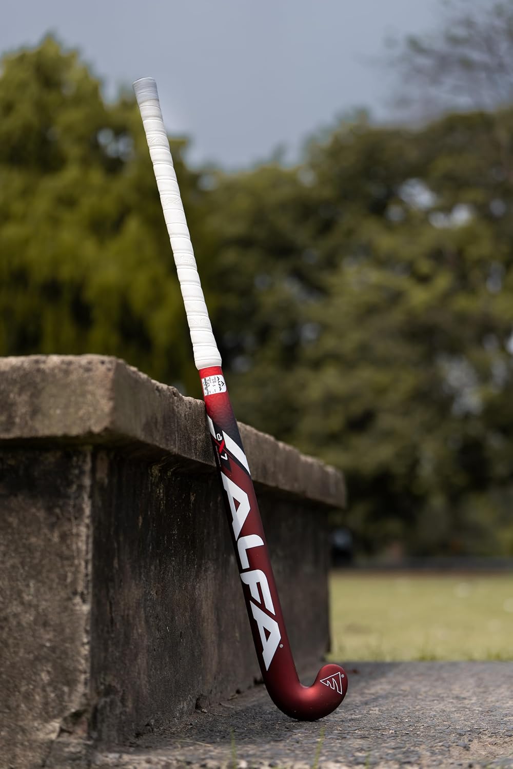 ALFA AX7 Hockey Stick | Color: Red | Sizes : 36.5" | Material: 70% Carbon Composite | Gender: Unisex | Extra Low Bow for Drag Flicks | Optimized Lightweight Design | Durable High-Performance Stick | Versatile for All Playing Styles | Comes with Stick Bag.